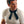 Man wearing a black neckerchief with a white t-shirt