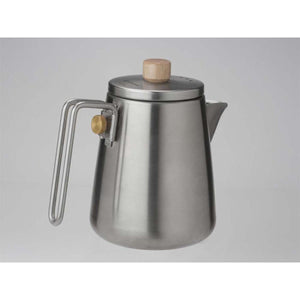 Snow Peak stainless steel kettle with wooden lid knob and brass handle detail