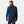 Man wearing a navy Helly Hansen quilted vest over a blue long sleeve shirt