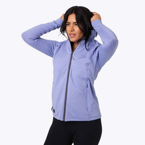 Woman wearing a light purple zip up hooded jacket with textured fabric