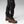 Fjallraven trekking trousers with side ventilation zippers open at the calf worn with brown hiking boots