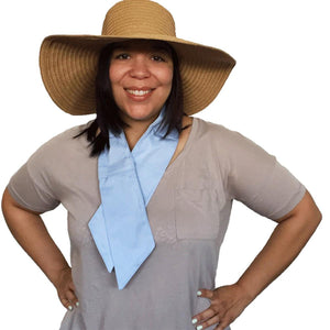 Person wearing a Polar Products light blue cooling neck wrap and a wide brim straw hat