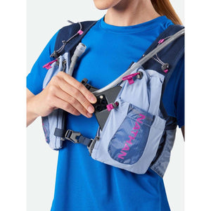 Person wearing a Nathan hydration vest with a smartphone in the front pocket