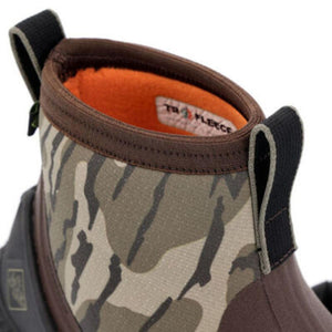 Muck camouflage boot with orange fleece lining and pull tabs