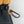 Mobile Warming glove detail showing black carabiner attached to tan leather grommet