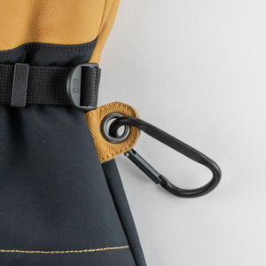Mobile Warming glove detail showing black carabiner attached to tan leather grommet