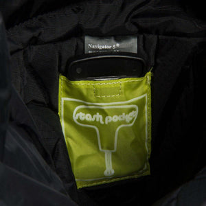 Interior lime green stash pocket inside a black Navigator 5 backpack