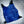 AlphaCool blue cooling vest with adjustable straps surrounded by ice cubes