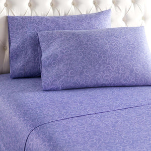 Purple bed sheets and pillowcases with a tonal floral damask pattern