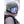 Person wearing a Smith Optics olive green ski helmet and blue mirrored goggles in the snow