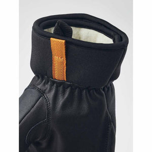 Hestra black leather glove cuff with orange pull tab and white fleece lining