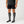 Person wearing Gobi Heat grey knee high socks with battery pocket