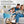 Ontel portable fan on a side table next to a family sitting on a couch