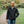 Man wearing a black ActionHeat heated jacket outdoors