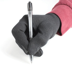 Hand wearing a black touchscreen glove holding a pen