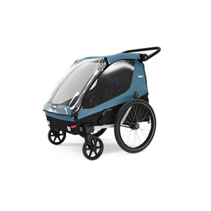 Thule blue child bike trailer with clear weather cover