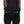 Person wearing black FNDN heated mittens with adjustable wrist straps