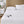 Beautyrest heated mattress pad with two wired controllers on a white bed