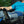 Person resting in a recliner with a blue compression wrap on their knee