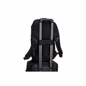 Thule black backpack attached to luggage handle