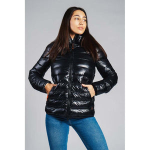Woman wearing a black 8K FlexWarm puffer jacket with a high collar and front zip pockets