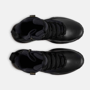 Top view of black Under Armour tactical boots with side zippers and lace up closure