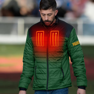 Man wearing a green Packers heated puffer jacket with glowing orange heating elements on the chest