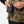 Person connecting a Mobile Warming power bank to a camo vest