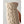 Close up of a beige cable knit wool glove with brown leather palm