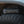 Outdoor Tech portable speaker resting on a rugged off road vehicle tire