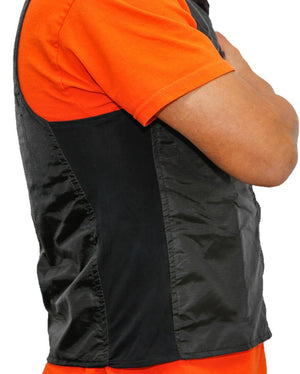 Side view of a person wearing a black vest over an orange t-shirt