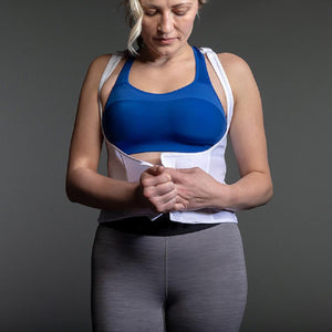 ThermApparel white cooling vest worn over a blue sports bra