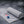 Grey cooling towel with New England Patriots logo on a dark textured surface