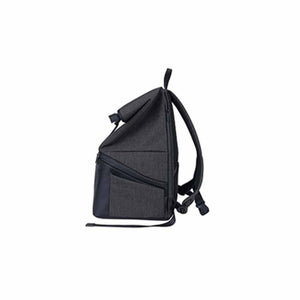 Side view of a charcoal grey roll top backpack with adjustable shoulder straps