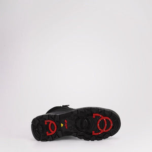 Black Pajar boot sole with red traction cleats
