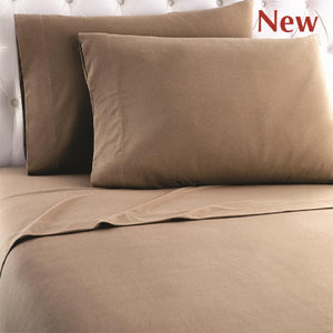 Shavel brown sheet set with two pillows on a tufted headboard
