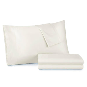 Cream colored pillowcase and folded sheet set