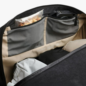 Interior view of a Bellroy Venture bag with organized pockets and packed items