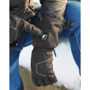 Person wearing black heated winter gloves with power button visible on the wrist