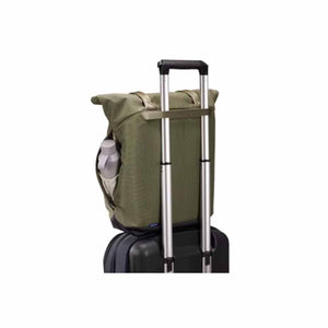 Olive green rolltop backpack attached to a rolling luggage handle
