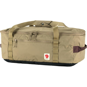 FjallRaven tan duffel bag with black base and brown side handle
