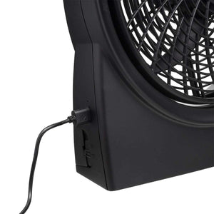 Black desk fan with power cable plugged into side port
