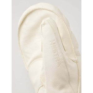 Close up of white Hestra leather mitten