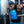 Man performing dips wearing an AlphaCool cooling vest with visible blue cooling channels