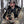 Hunter wearing Heater Body Suit camouflage gear holding deer antlers in a tree stand with a compound bow