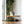 Green Snow Peak floor cushion on a wooden floor near a coffee table and houseplant