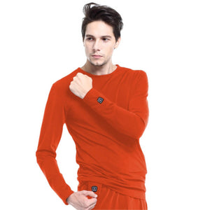 Man wearing orange Glovii long sleeve thermal shirt with power button on sleeve