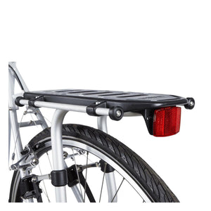 Thule bicycle rear rack with red reflector mounted over a bike wheel