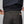Back view of dark grey FjallRaven trousers with elastic waistband and zippered pocket
