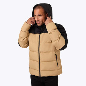 Man wearing a tan and black Mobile Warming hooded puffer jacket